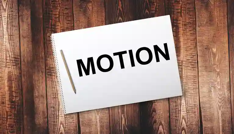 Bild på ett anteckningsblock med texten motion.