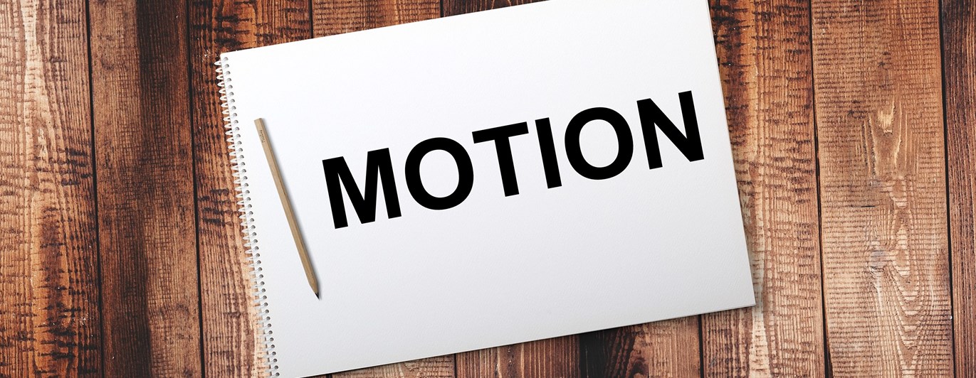 Bild på ett anteckningsblock med texten motion.