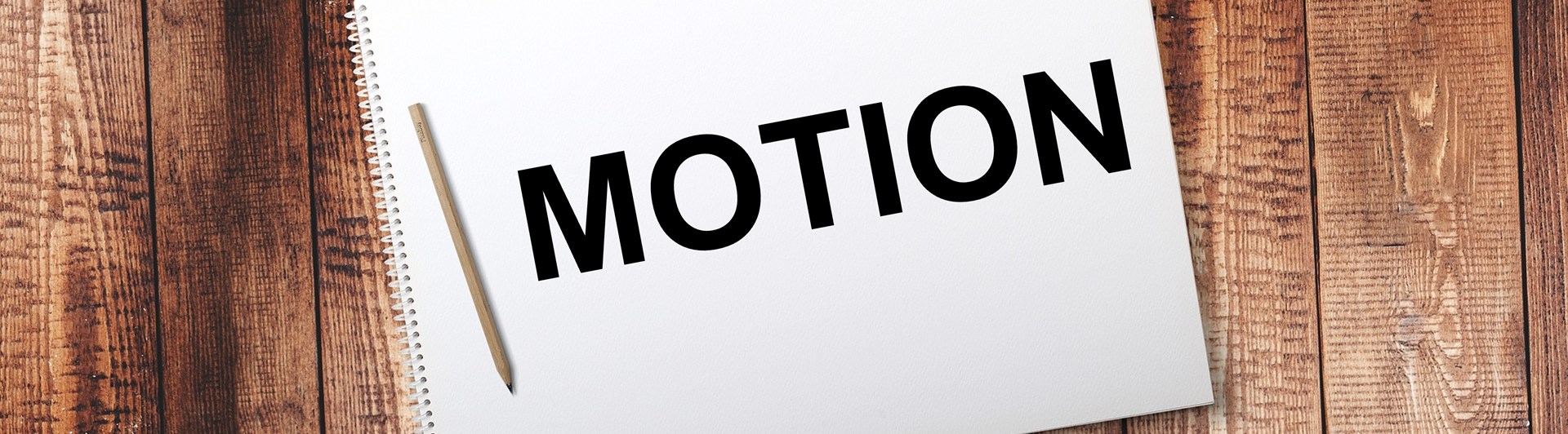Bild på ett anteckningsblock med texten motion.