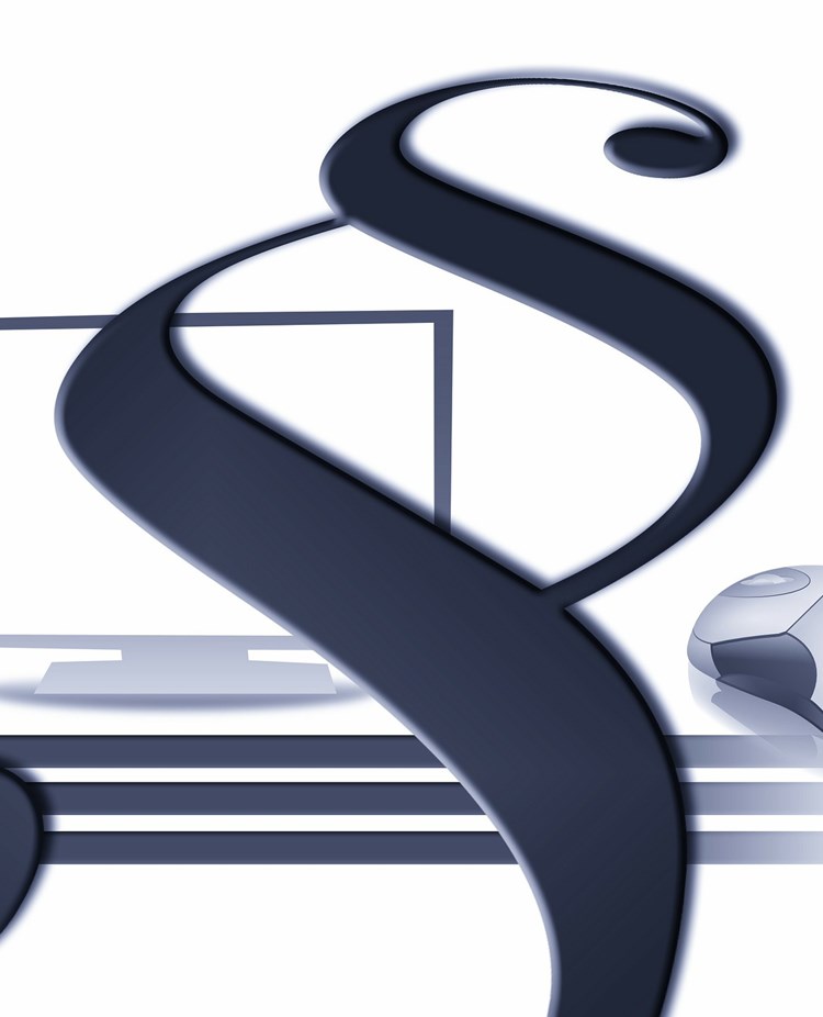 Bild på en paragraf framför en dator.