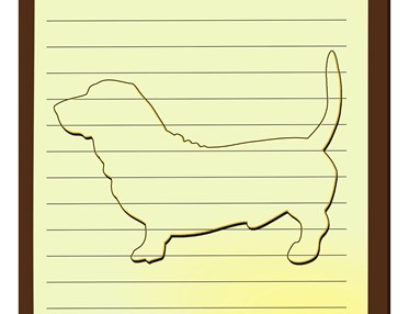 Tecknad hund av basset-typ på linjerat anteckningsblock