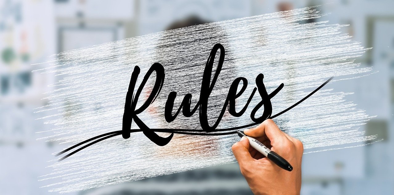 Hand som skriver rules