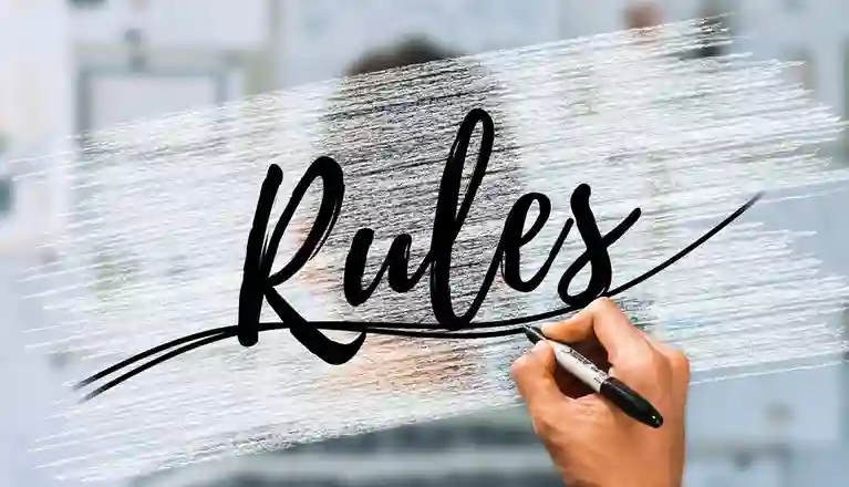 Hand som skriver rules