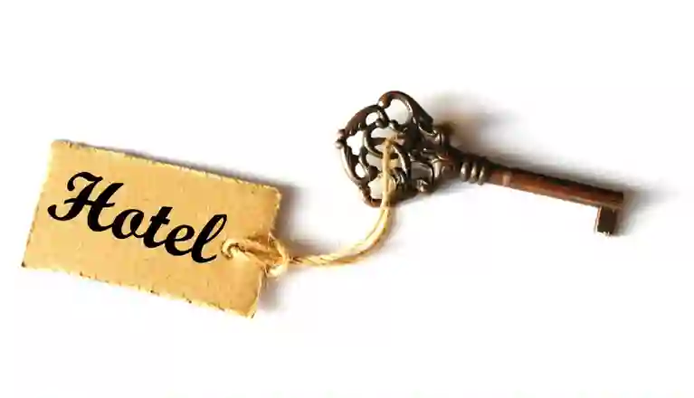 Bild som visar en gammaldags hotellnyckel.
